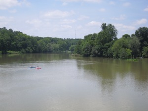 Kayaks on the river as seen from the trail