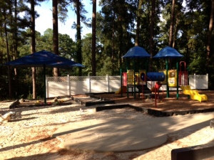 View of smaller slide structure and one of the sandboxes
